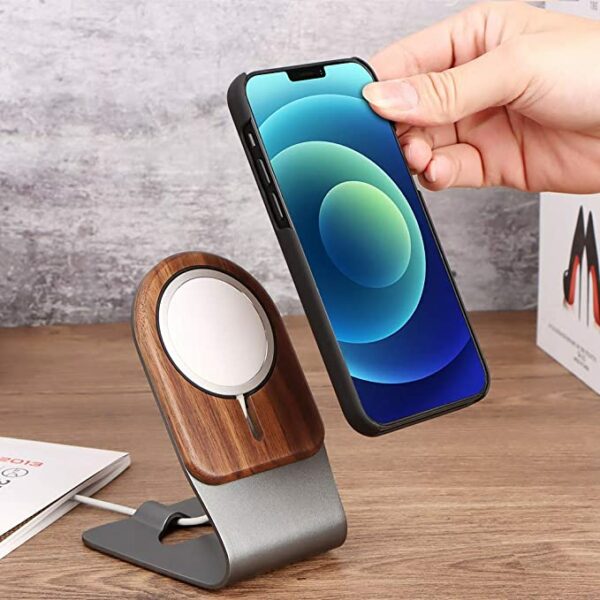 image of a cellular phone device and a wooden stand with a charger