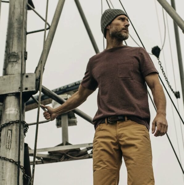 image of a man wearing a dark red shirt and brown pants