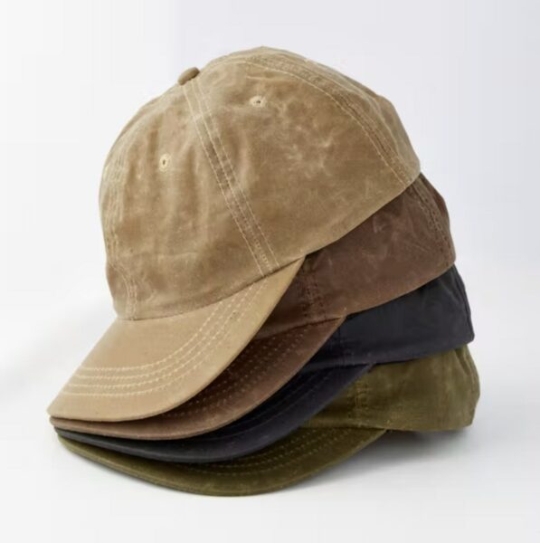 image of four ball caps stacked on top of one another