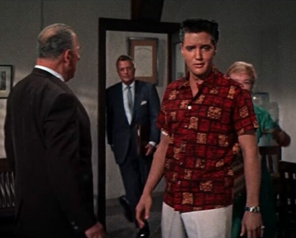 image of elvis presley wearing a red printed short sleeve shirt