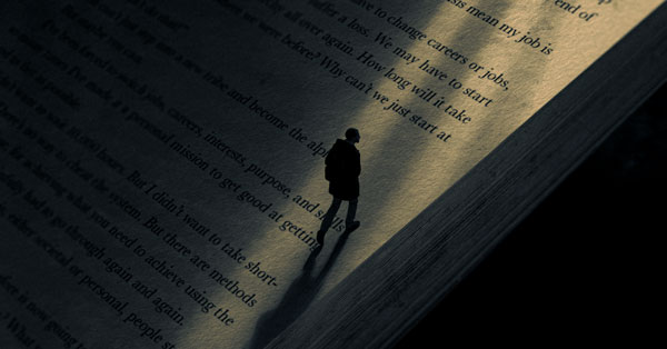 a graphic featuring the silhouette of a person walking along the page of a book
