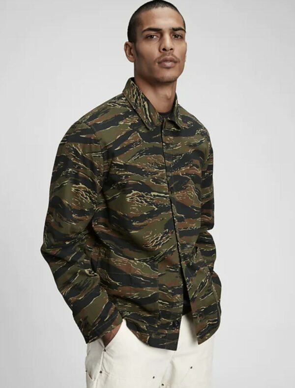 image of a man wearing a camo print chore style jacket