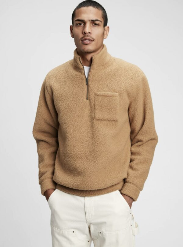 image of a man wearing a brown half zip jacket