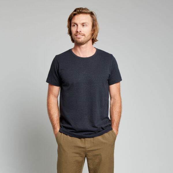 image of a man wearing a black short sleeve shirt