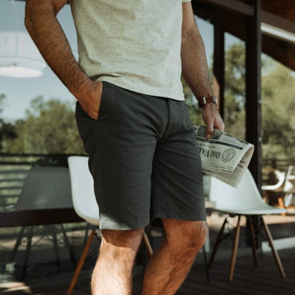 image of a person wearing blue shorts and white shirt