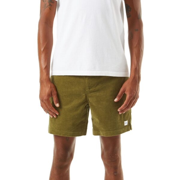 image of a person wearing green shorts white shirt