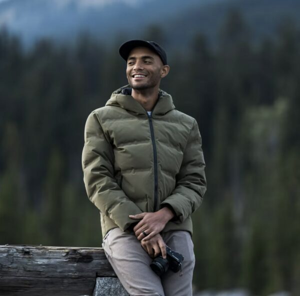 image of a man wearing a green puffer style jacket