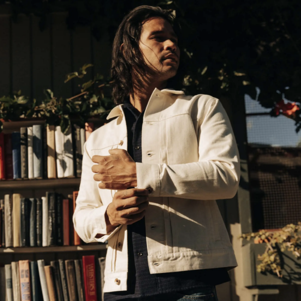 image of a man wearing a white button up jacket