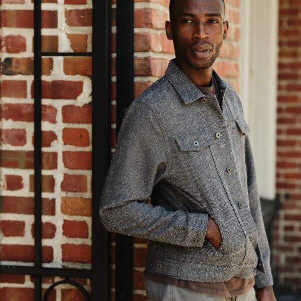 image of a person wearing a grey trucker style jacket