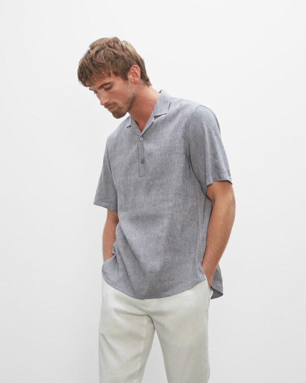 image of a man wearing a short sleeve grey shirt