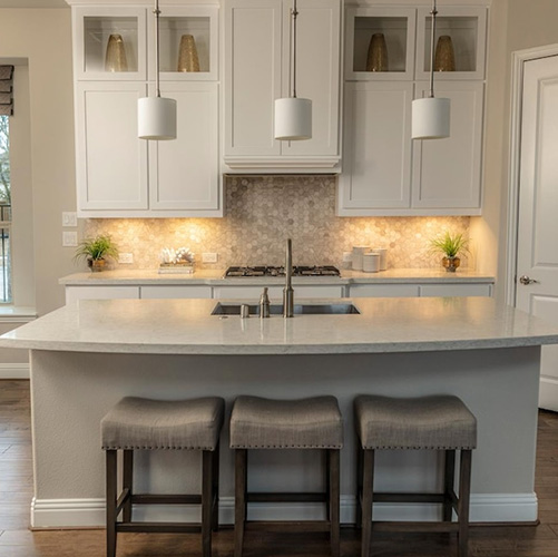 image of a kitchen area with under cabinet lighting