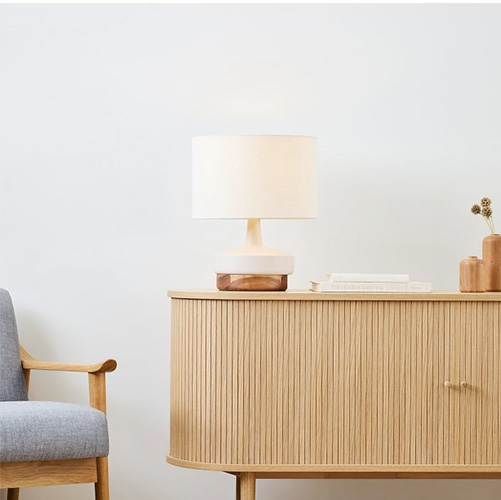 wood and ceramic table lamp on a table