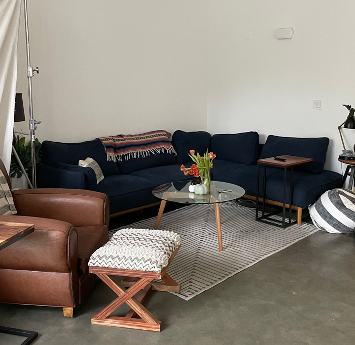 living room with blue couch