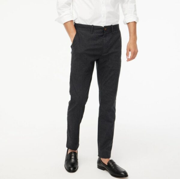 a person wearing black pants with black shoes