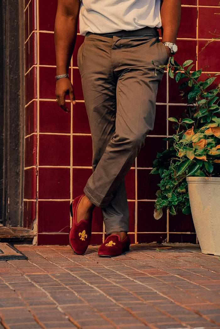 man wearing chinos and velvet slippers