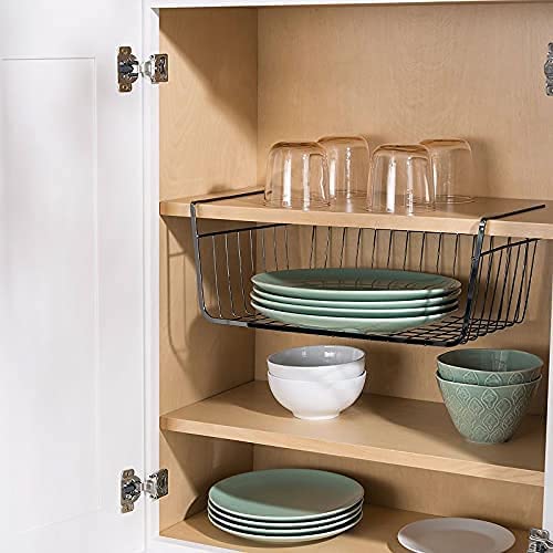 a wire dish organizer in a kitchen cabinet