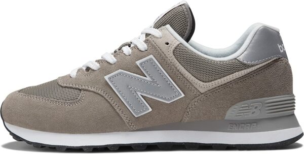 a grey and white nike new balance sneaker shoe