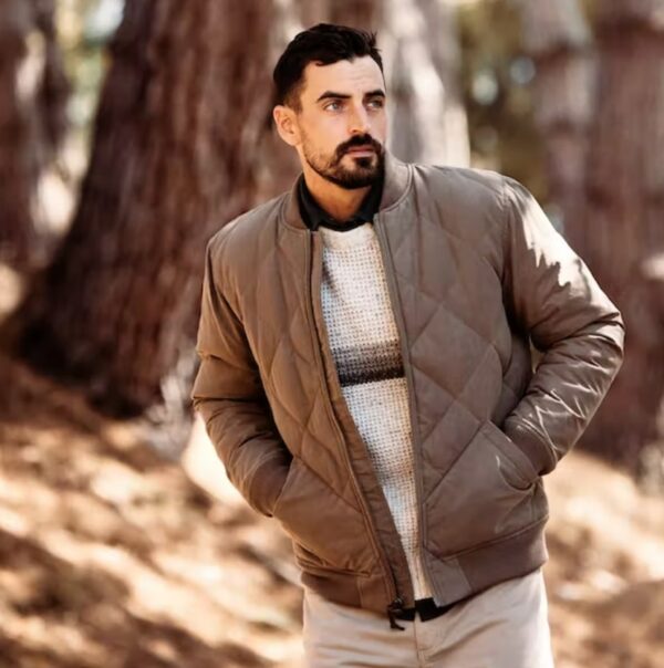 a man wearing a brown quilted jacket