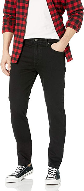 a person wearing black taper fit jeans