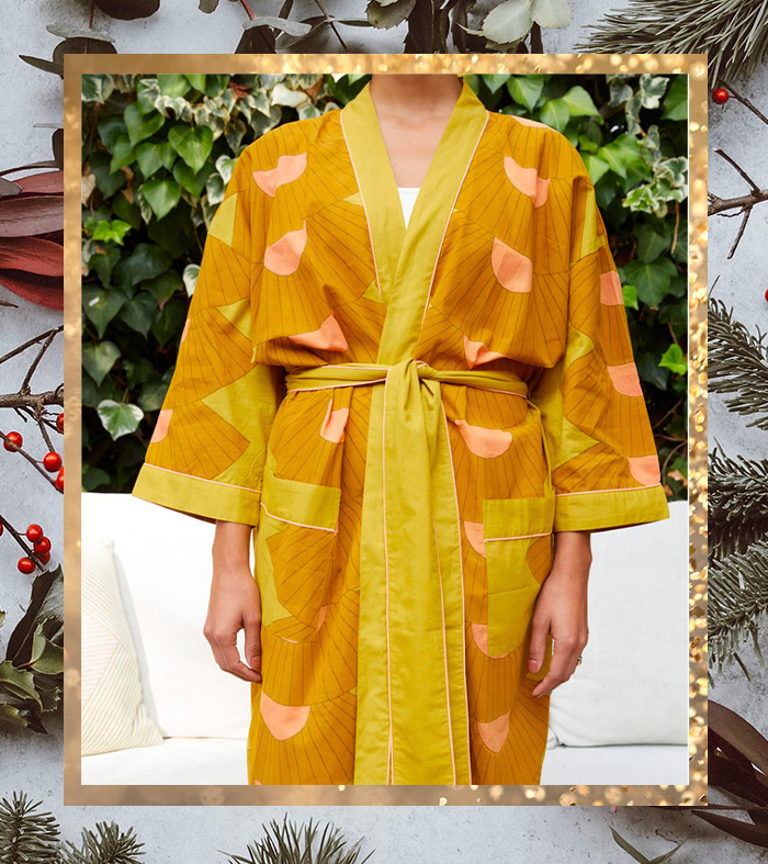 a women wearing a brightly colored patterned robe