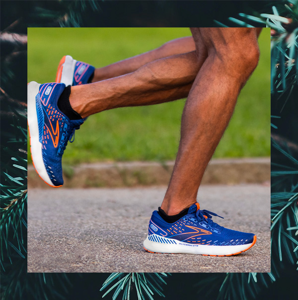 man wearing brooks running shoes while running