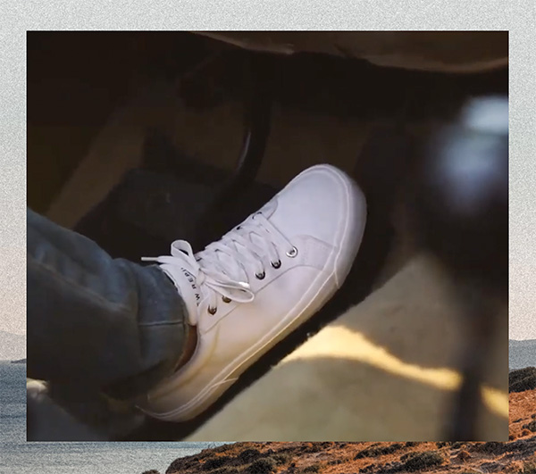 a close up image of a white canvas sneaker