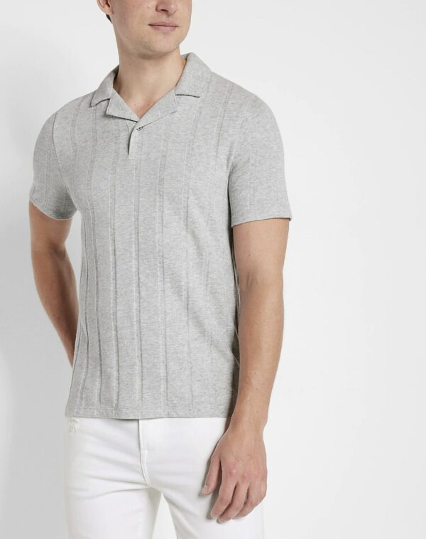 a man wearing a grey ribbed polo shirt