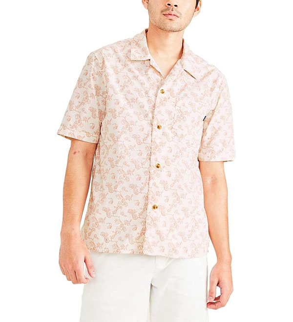 a man wearing a short sleeve button front camp collar shirt