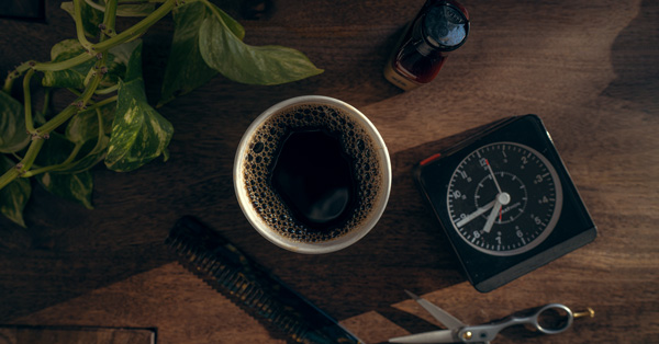 a cup of coffee and an alarm clock