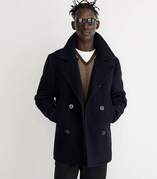 man wearing navy pea coat