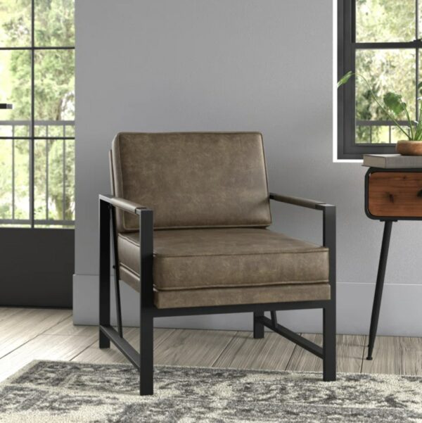 a faux leather and iron plated frame armchair