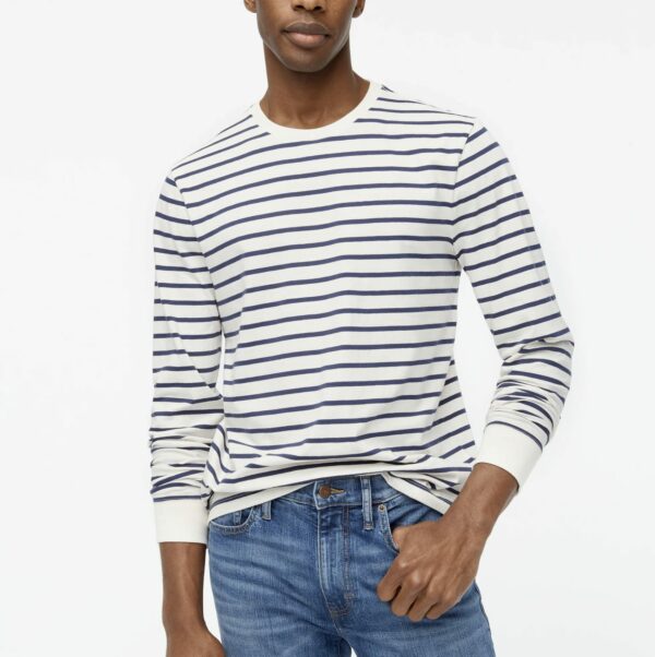 a man wearing a striped long sleeve jersey shirt