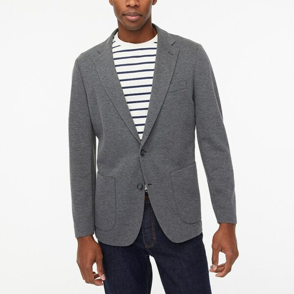 a man wearing a knit blazer over a jersey shirt