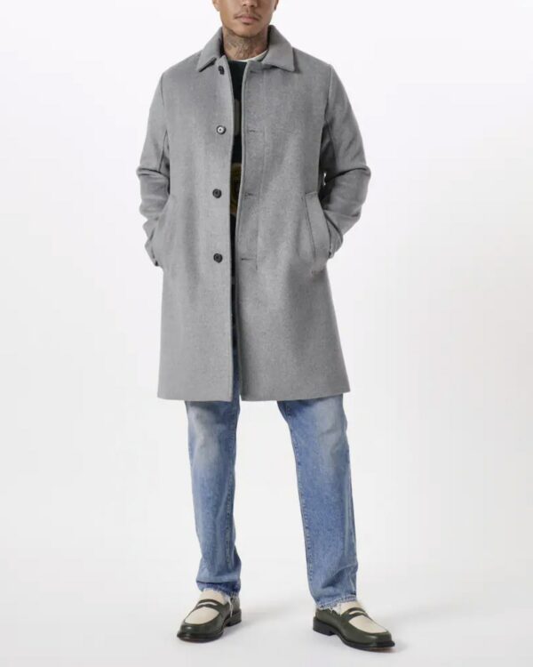 a man wearing a grey coat