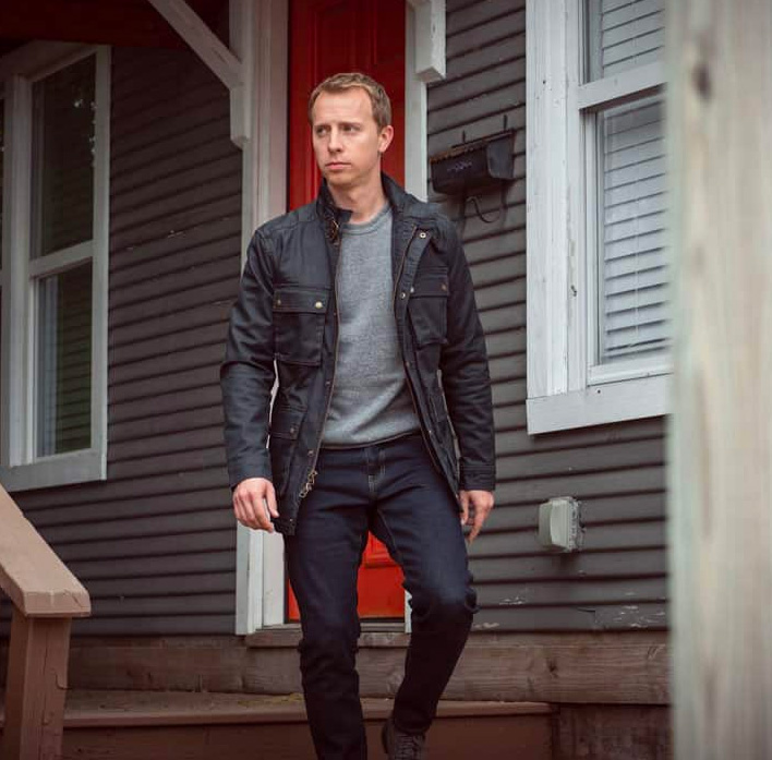 waxed jacket with grey sweatshirt