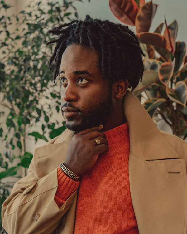 trench coat with orange sweater