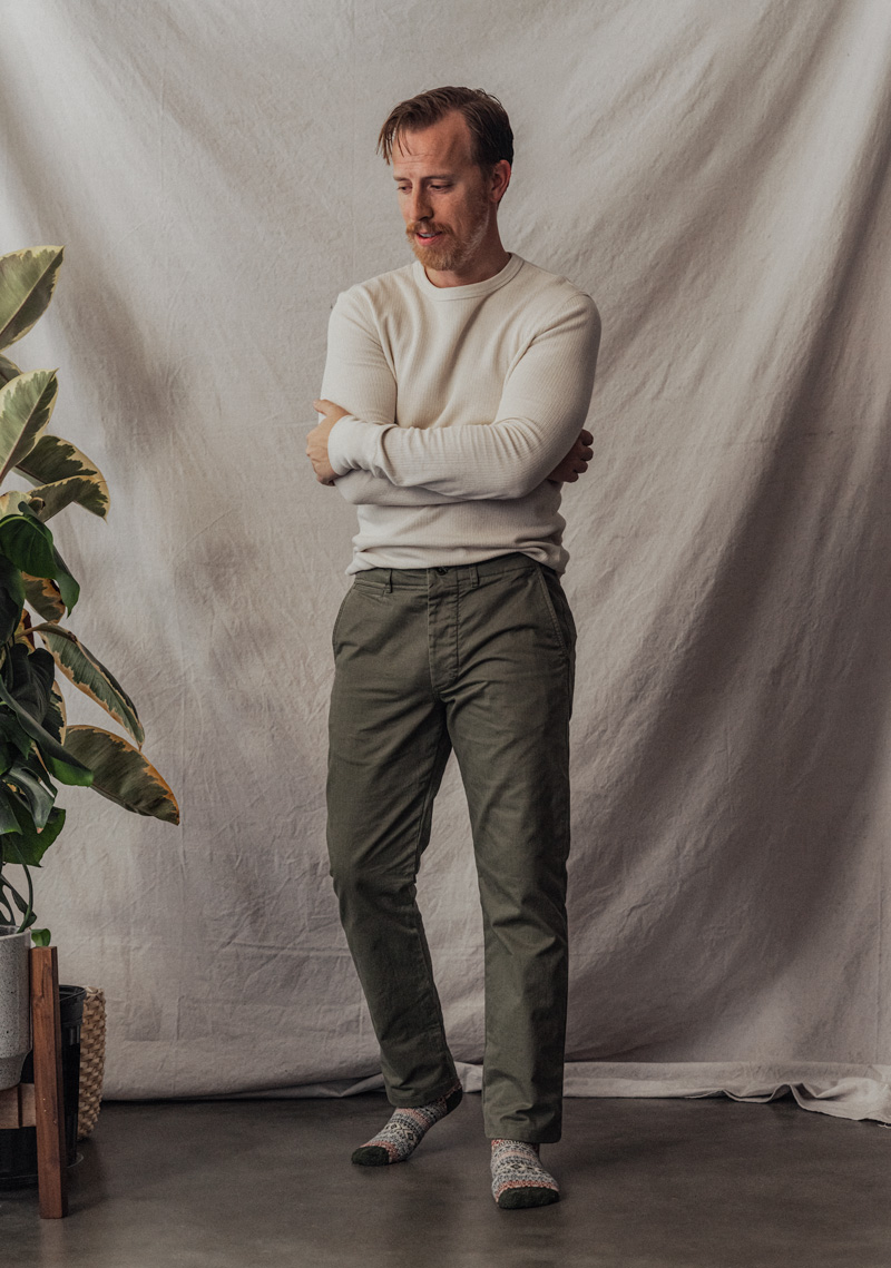 man wearing buck mason officer pant with thermal shirt