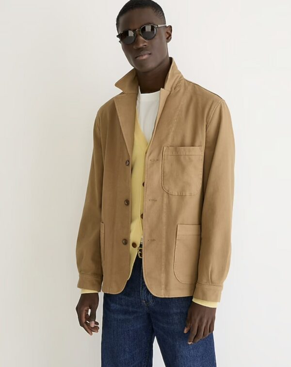 a man wearing a chore blazer over a shirt and vest