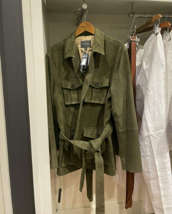 a suede jacket with tie waist belt