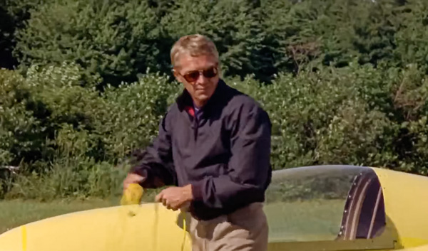 steve mcqueen in the thomas crown affair wearing a blue harrington jacket