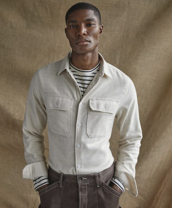 a man wearing a long sleeve button front chamois shirt