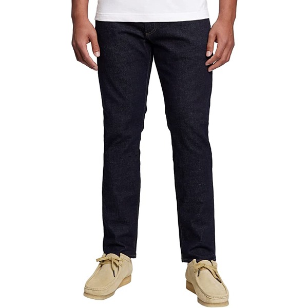 a man wearing slim fit jeans and boots