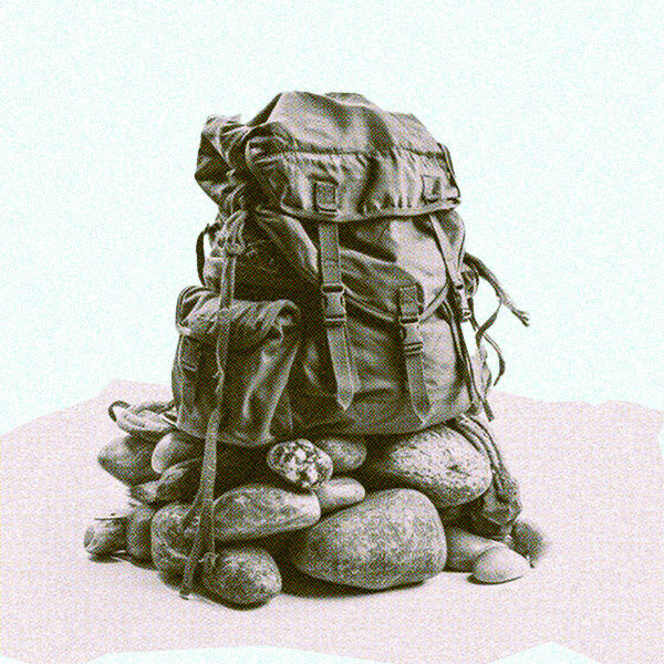 a backpack sitting on a pile of stones