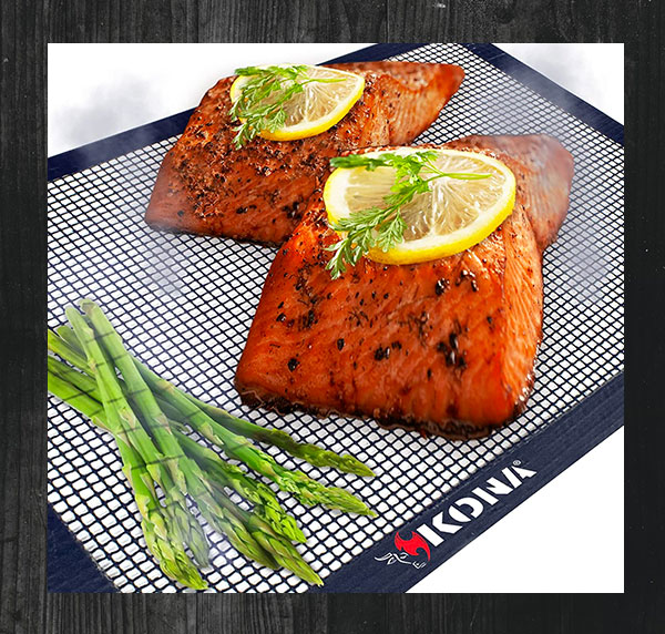 a barbecue grill matt with vegetables and meat displayed on the mat