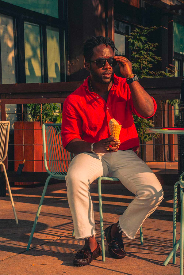 summer outfit with red linen shirt and white jeans and brown loafers