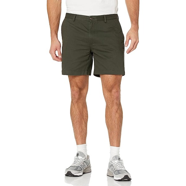 a man wearing slim fit shorts with athletic style shoes