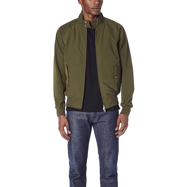 a man wearing a baracuta style classic jacket over a shirt and denim jeans