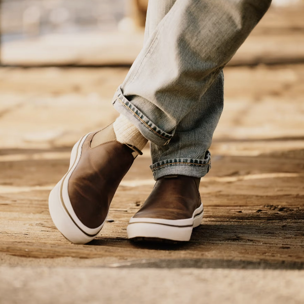 a close up image of a person sweating low top slip on shoes