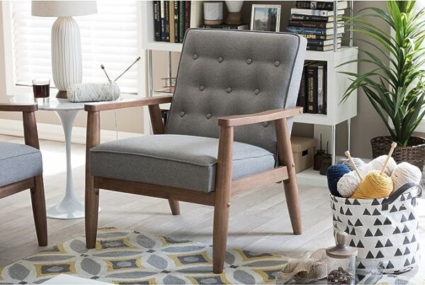 an upholstered lounge chair with wooden frame