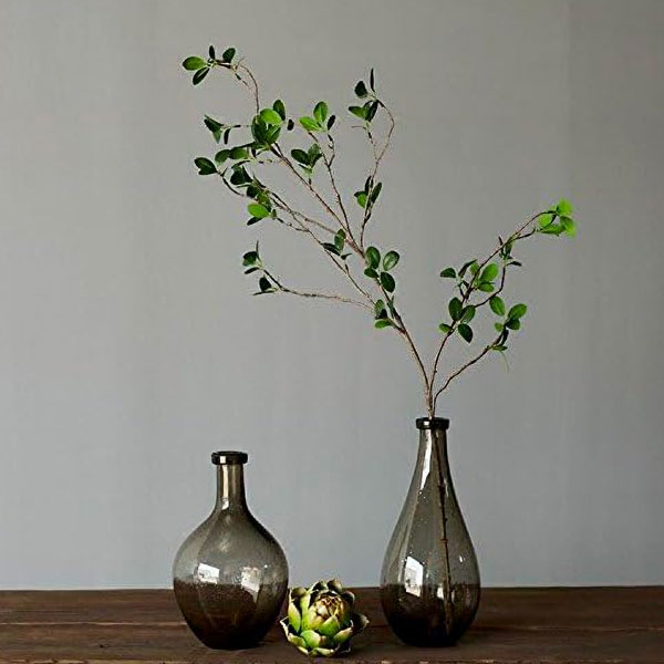 faux eucalyptus in a gray jar